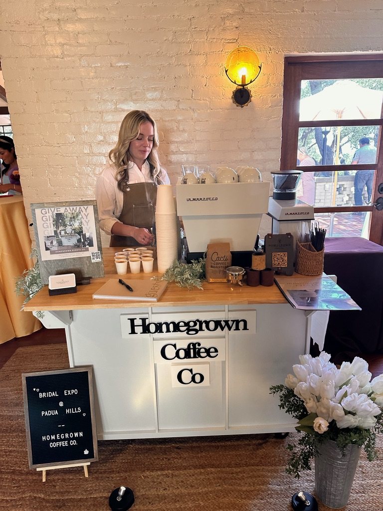 Homegrown barista serving from the coffee cart at the Padua Hills Bridal Expo