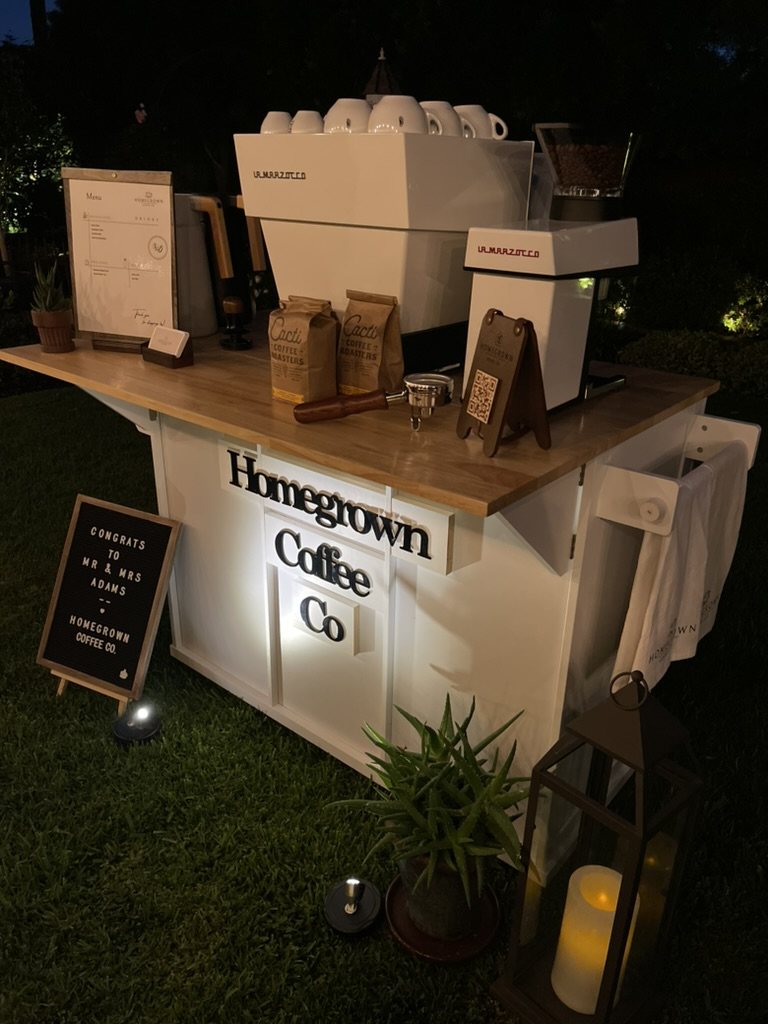 Illuminated Homegrown coffee cart ready for an evening wedding