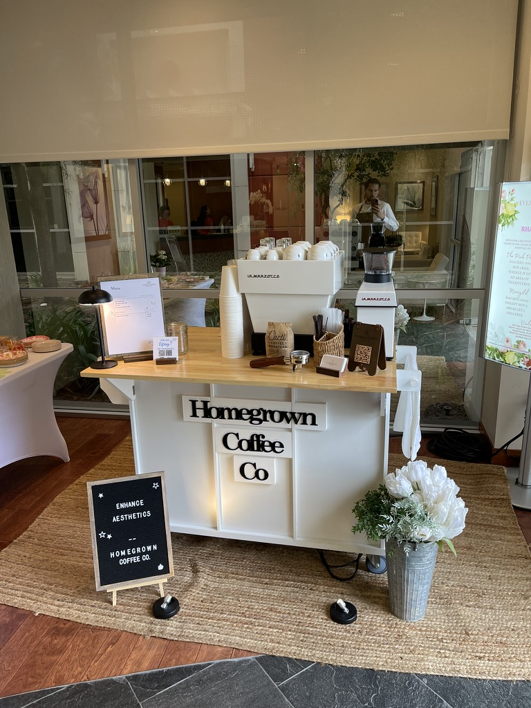 Homegrown mobile coffee cart set up at an indoor event