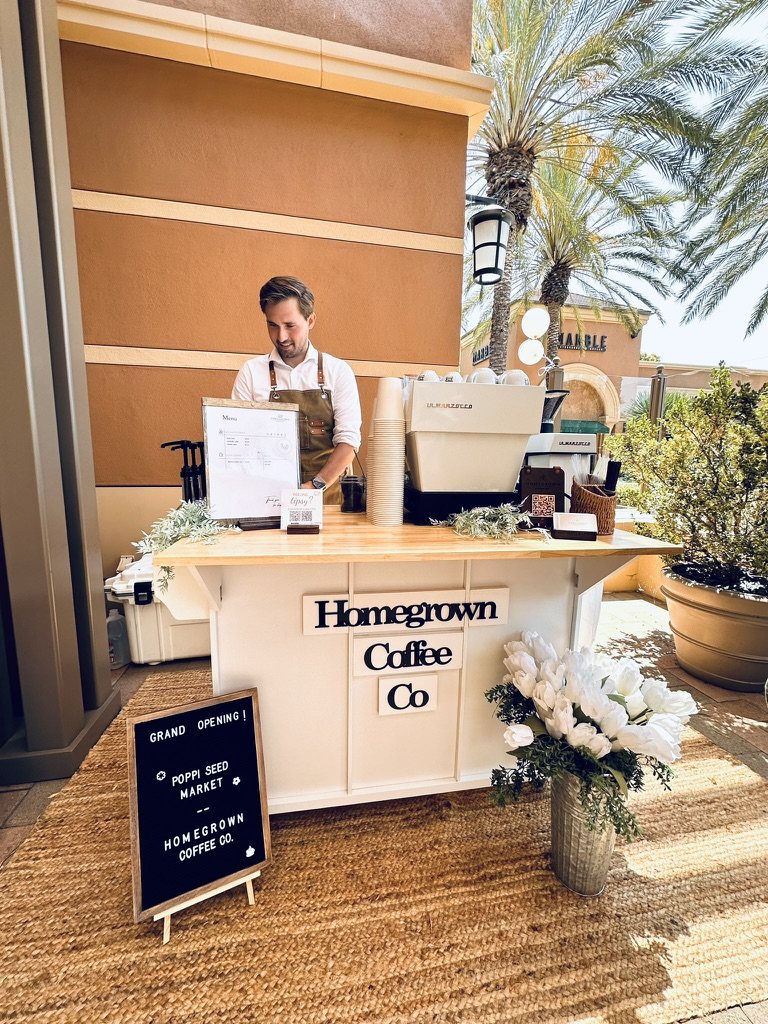 Homegrown coffee cart serving a grand-opening celebration at an outdoor market