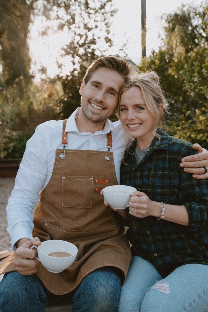 Dane and Caitlin sharing coffee outdoors