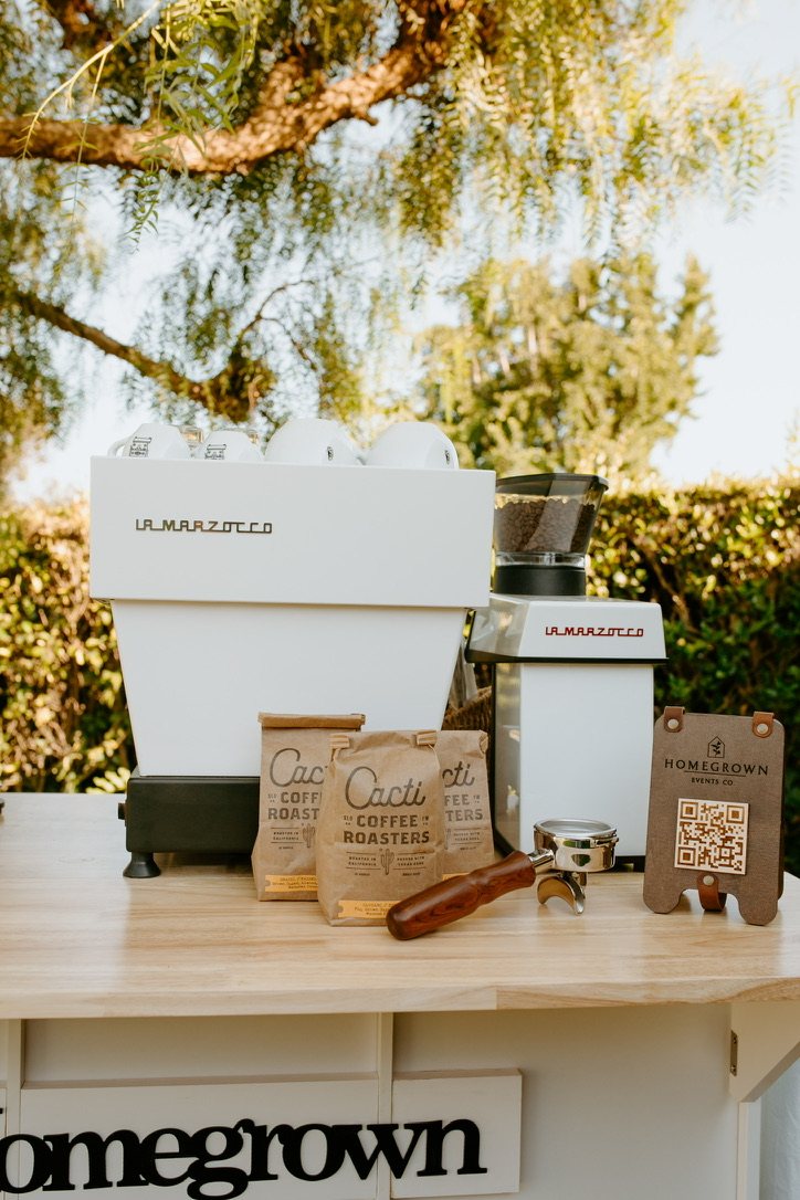 Homegrown espresso machine, coffee beans, and event ordering sign
