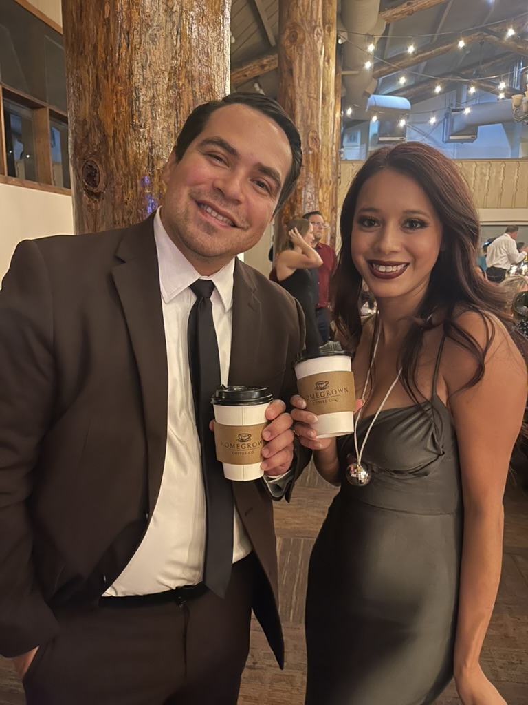 Event guests holding Homegrown coffee cups